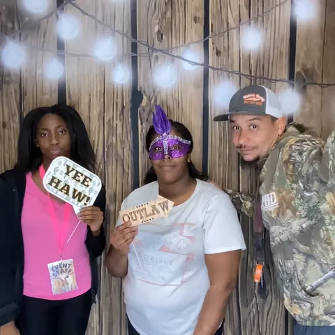 Friends in a photo booth Boomerang at Firefly Ridge Ranch