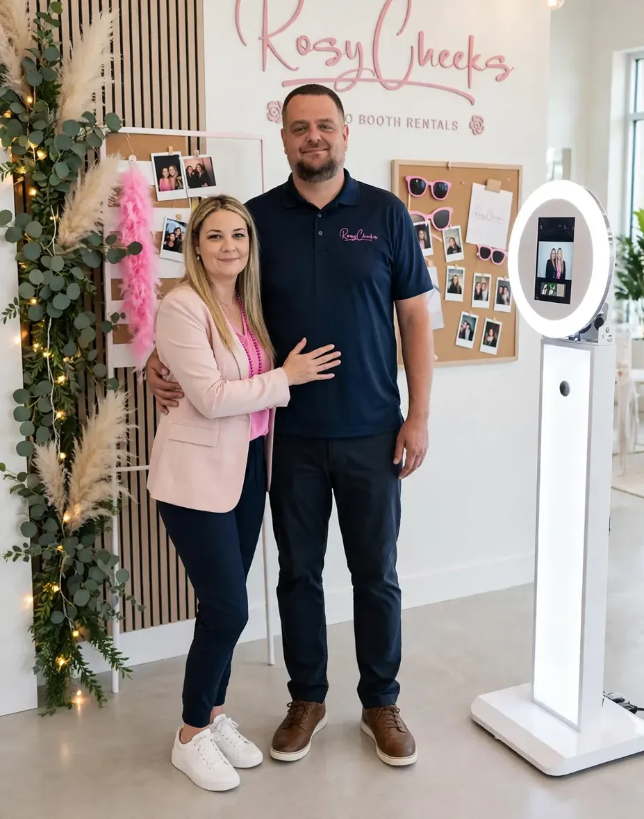 Sarah and Mike, owners of Rosy Cheeks Photo Booths, standing with their photo booth