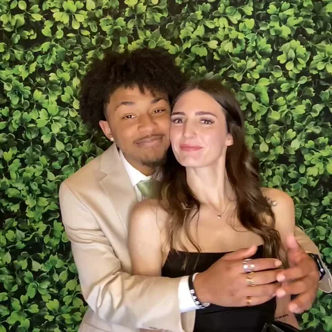 Couple posing for a photo booth Boomerang