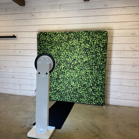 Photo booth kiosk beside the Hedge backdrop at The Establishment Barn