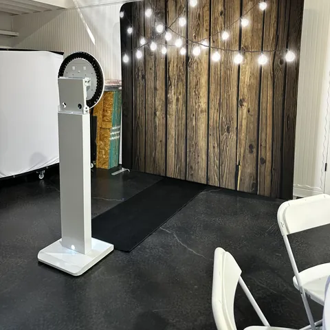 Photo booth and Dark wood with string lights backdrop at Tynli Timber Events