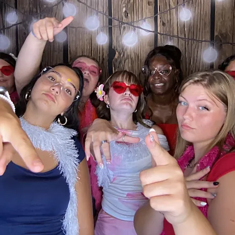 Friends pulling faces and posing together at London’s Sweet Sixteen